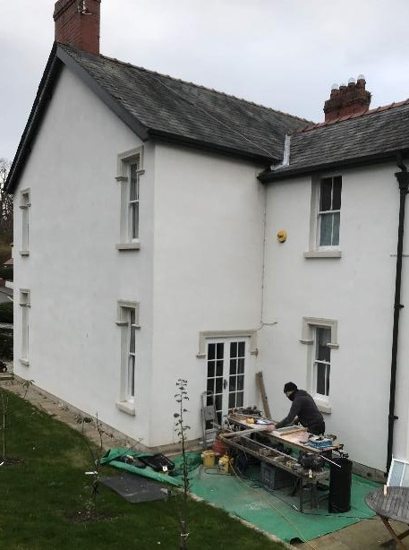 Joiner working at the rear of a beautiful double fronted Victorian house