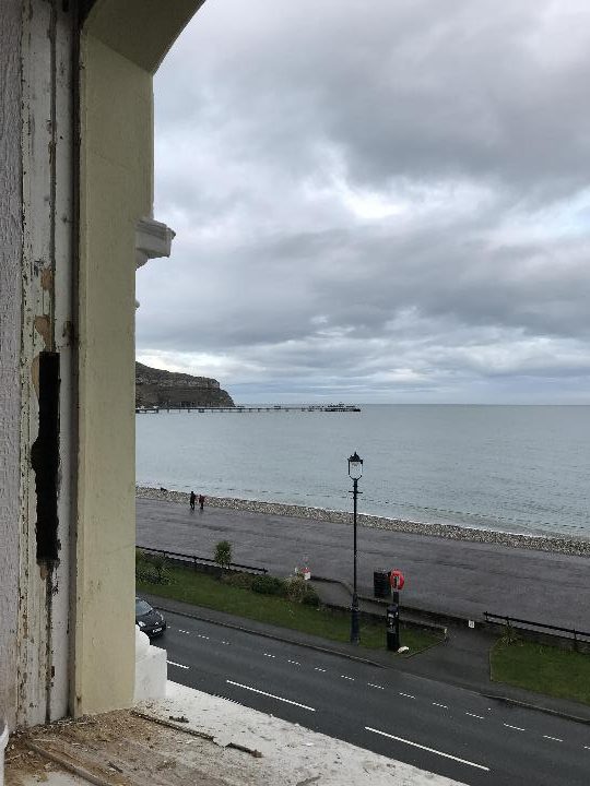 View of promenade and sea from a hotel window